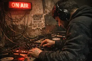 DJ in a dimly lit Brixton basement studio using a mixing desk, ON AIR sign glowing above, gritty documentary style.